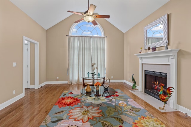 6769 Cold Stream Dr, Nashville, TN 37221 - living area with ceiling fan, plenty of natural light, a tile fireplace, wood finished floors, and high vaulted ceiling