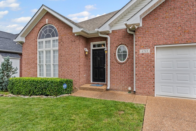 6769 Cold Stream Dr, Nashville, TN 37221 - property entrance with a lawn, a shingled roof, brick siding, and a garage