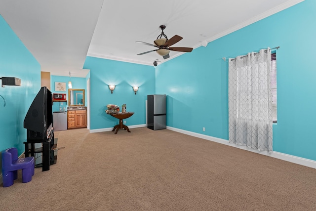6769 Cold Stream Dr, Nashville, TN 37221 - carpeted cinema featuring crown molding, a ceiling fan, and baseboards