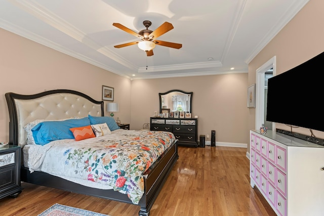 6769 Cold Stream Dr, Nashville, TN 37221 - bedroom with a raised ceiling, light wood-style flooring, crown molding, a ceiling fan, and baseboards
