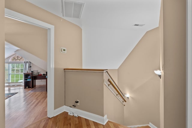 6769 Cold Stream Dr, Nashville, TN 37221 - stairway featuring lofted ceiling, wood finished floors, baseboards, and attic access