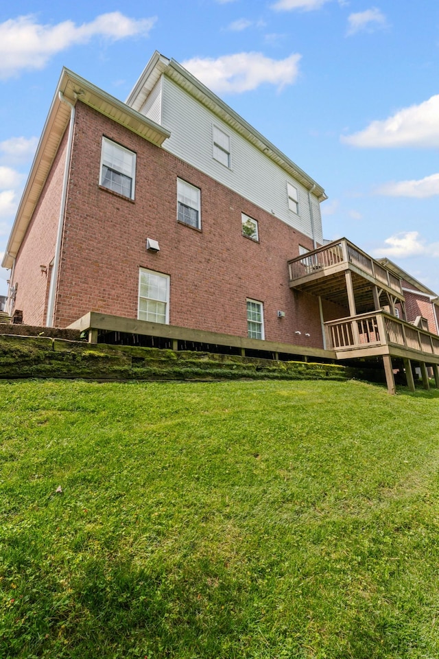 6769 Cold Stream Dr, Nashville, TN 37221 - rear view of property featuring a yard, brick siding, and a deck