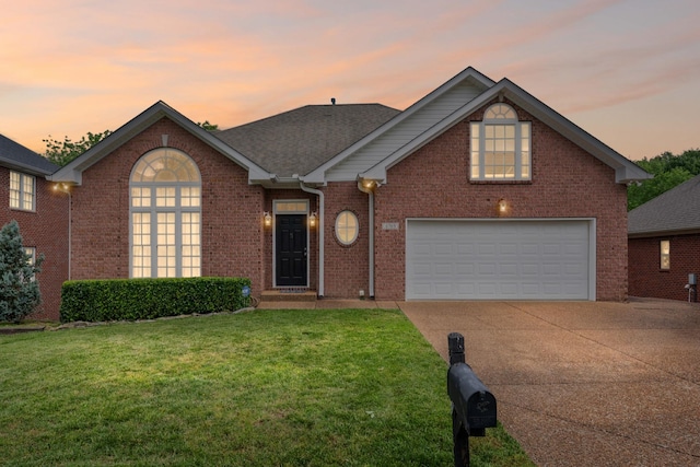 6769 Cold Stream Dr, Nashville, TN 37221 - traditional-style house with driveway, a front yard, and brick siding