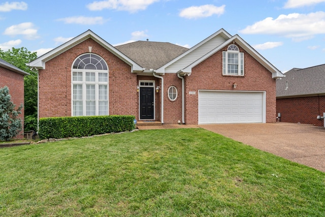 6769 Cold Stream Dr, Nashville, TN 37221 - view of front of house with concrete driveway, brick siding, a front yard, and an attached garage