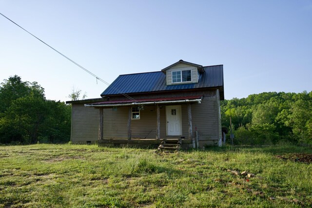 40A Barker Cove Loop, Palmer, TN 37365 - rear view of house featuring a porch and metal roof