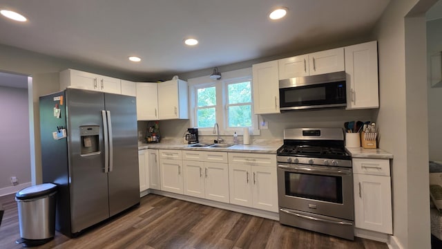 500 E 17th St, Columbia, TN 38401 - kitchen with appliances with stainless steel finishes, a sink, light countertops, dark wood-style floors, and recessed lighting