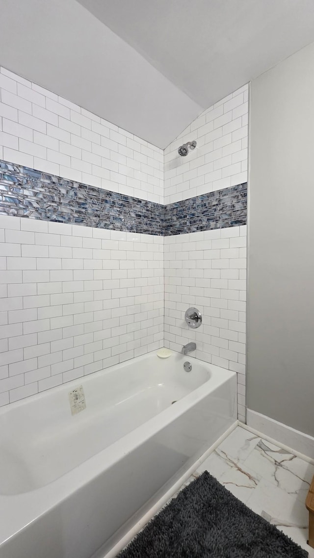 500 E 17th St, Columbia, TN 38401 - full bathroom with shower / bath combination, baseboards, marble look tiles, and lofted ceiling