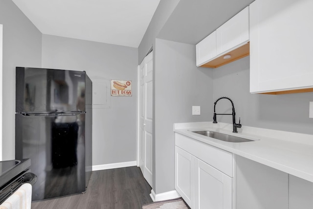 1301 Neelys Bend Rd Unit A10, Madison, TN 37115 - kitchen featuring freestanding refrigerator, a sink, light countertops, dark wood-style flooring, and white cabinets