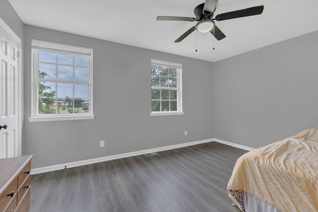 1301 Neelys Bend Rd Unit A10, Madison, TN 37115 - bedroom featuring dark wood-style flooring, baseboards, and ceiling fan