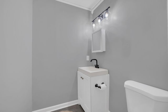 1301 Neelys Bend Rd Unit A10, Madison, TN 37115 - bathroom with crown molding, toilet, baseboards, and vanity