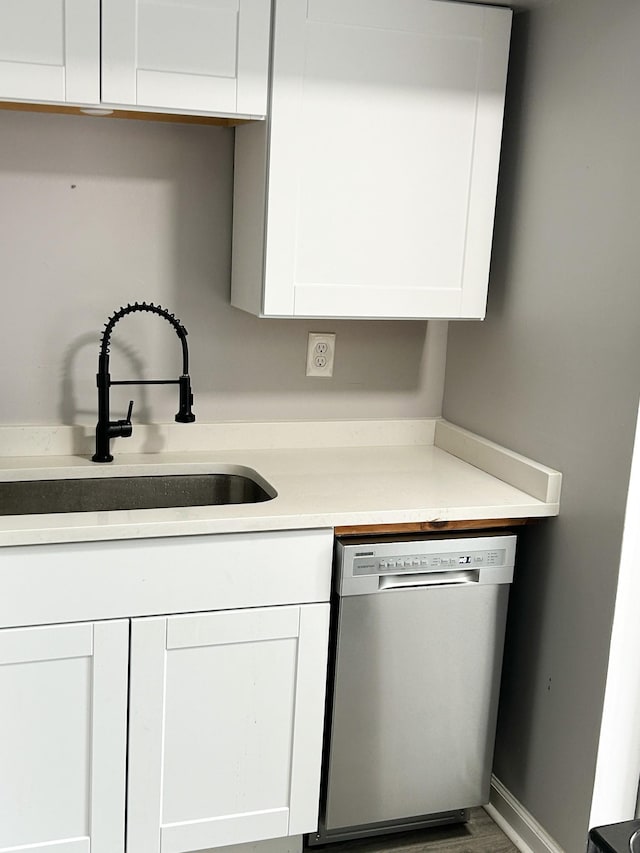 1301 Neelys Bend Rd Unit A10, Madison, TN 37115 - kitchen featuring stainless steel dishwasher, a sink, white cabinets, and light countertops