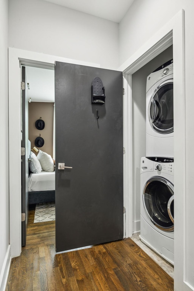 2910 Felicia St Unit 18, Nashville, TN 37209 - clothes washing area with stacked washer and clothes dryer and dark wood-style flooring