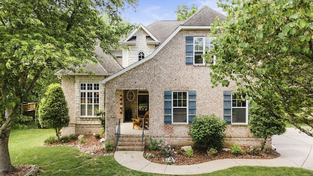 4019 Fremantle Cir, Spring Hill, TN 37174 - view of front of house with roof with shingles, brick siding, and a front lawn
