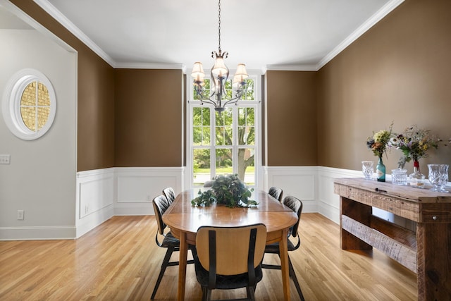 4019 Fremantle Cir, Spring Hill, TN 37174 - dining area featuring a chandelier, light wood-style floors, ornamental molding, and wainscoting