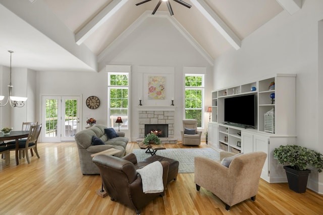 4019 Fremantle Cir, Spring Hill, TN 37174 - living room with high vaulted ceiling, light wood-type flooring, a chandelier, a fireplace, and beam ceiling