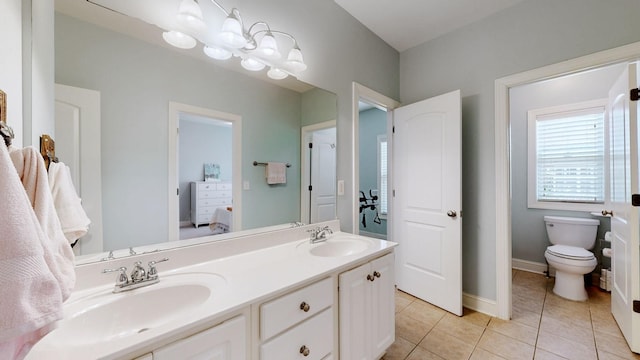 4019 Fremantle Cir, Spring Hill, TN 37174 - full bathroom featuring tile patterned flooring, double vanity, toilet, and ensuite bathroom