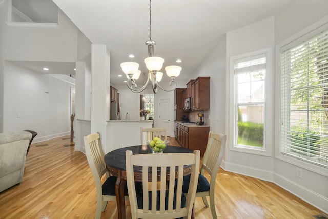 4019 Fremantle Cir, Spring Hill, TN 37174 - dining room featuring a chandelier, healthy amount of natural light, light wood finished floors, baseboards, and recessed lighting