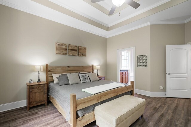4019 Fremantle Cir, Spring Hill, TN 37174 - bedroom with wood finished floors, crown molding, baseboards, connected bathroom, and a tray ceiling
