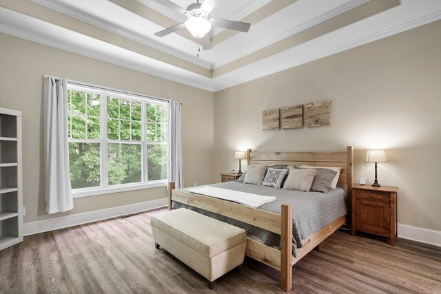4019 Fremantle Cir, Spring Hill, TN 37174 - bedroom featuring wood finished floors, crown molding, baseboards, a raised ceiling, and a ceiling fan