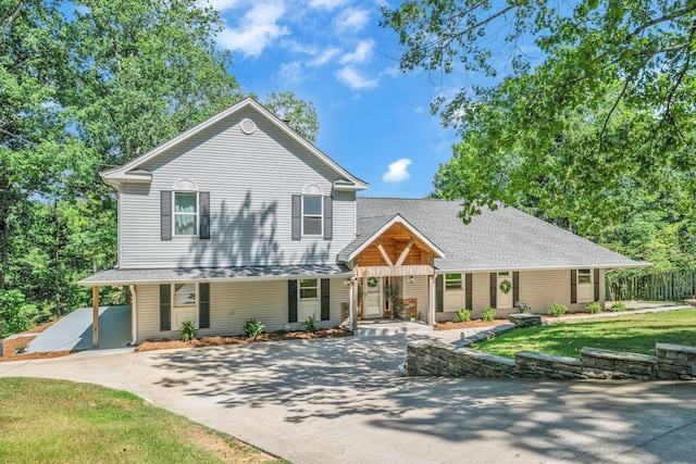 106 Lakewood Dr, Dickson, TN 37055 - view of front of property with a porch, a front lawn, and roof with shingles