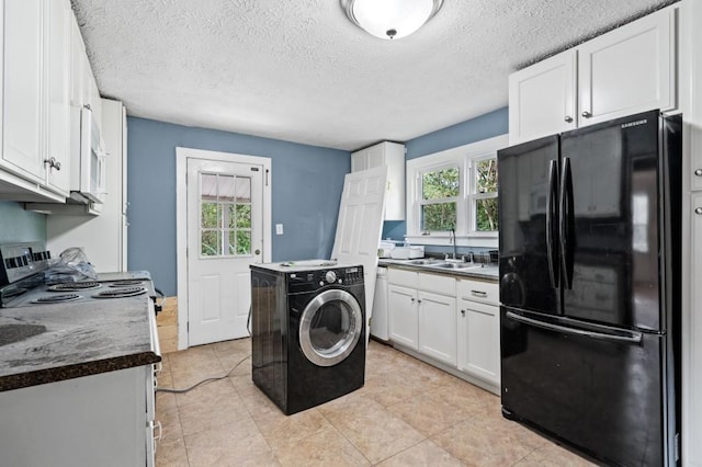 119 Wynns Ferry Rd, Dover, TN 37058 - clothes washing area with washer / clothes dryer, a textured ceiling, and light tile patterned flooring