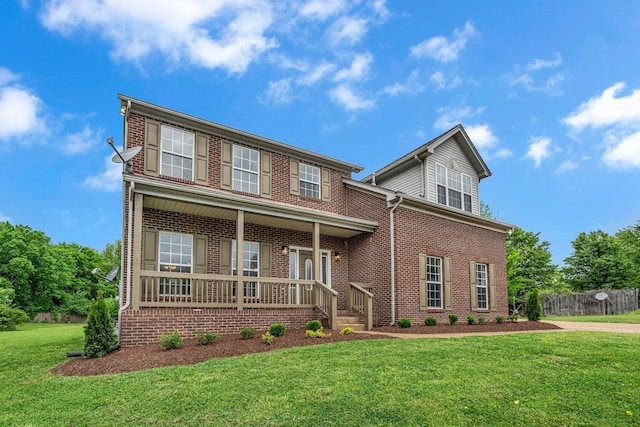 408 Jordan Leigh Ct, Joelton, TN 37080 - traditional-style house with a porch, a front yard, and brick siding