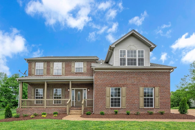 408 Jordan Leigh Ct, Joelton, TN 37080 - view of front of home featuring a porch, brick siding, and a front yard