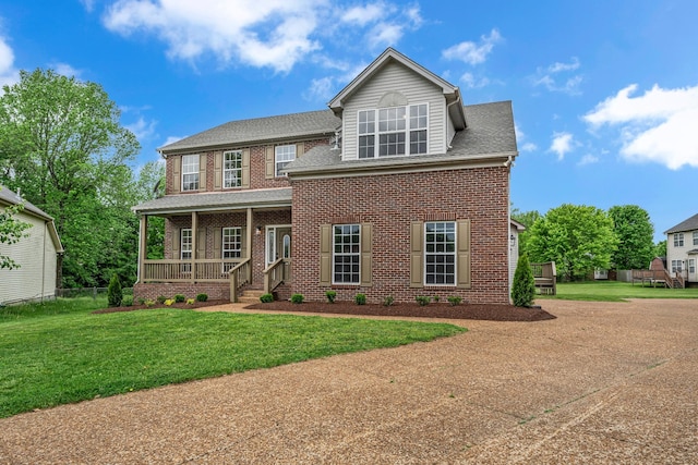 408 Jordan Leigh Ct, Joelton, TN 37080 - view of front of home featuring a porch, brick siding, a front lawn, and a shingled roof