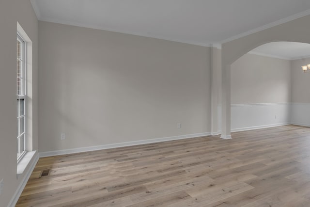 408 Jordan Leigh Ct, Joelton, TN 37080 - unfurnished room with arched walkways, plenty of natural light, light wood-type flooring, crown molding, and baseboards