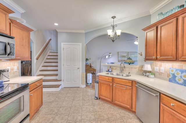 236 Danoher Walk, Murfreesboro, TN 37128 - kitchen with appliances with stainless steel finishes, a sink, arched walkways, backsplash, and light countertops