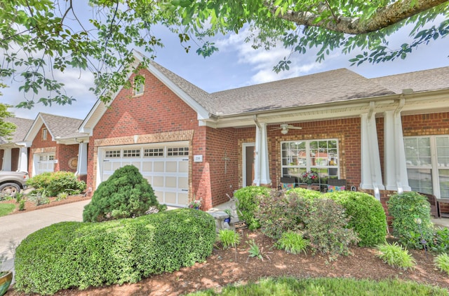 236 Danoher Walk, Murfreesboro, TN 37128 - view of front facade with brick siding, an attached garage, and a shingled roof