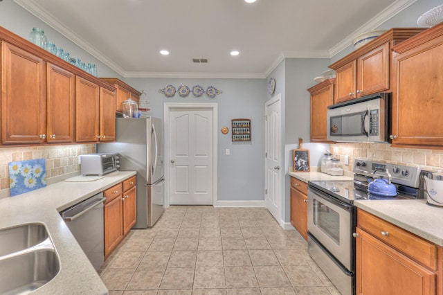 236 Danoher Walk, Murfreesboro, TN 37128 - kitchen featuring appliances with stainless steel finishes, backsplash, light countertops, brown cabinetry, and ornamental molding