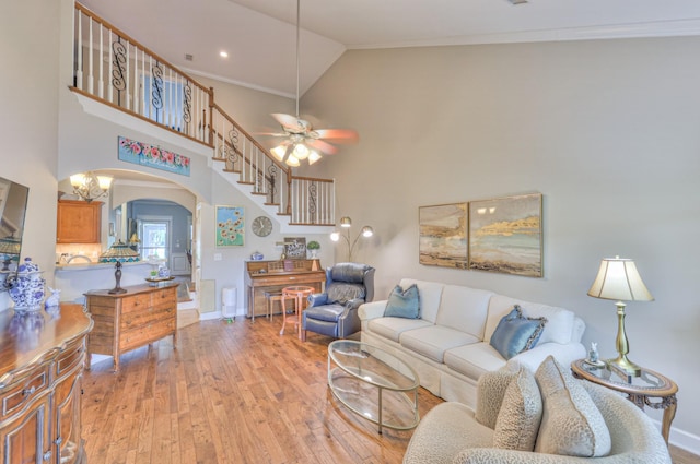 236 Danoher Walk, Murfreesboro, TN 37128 - living room with arched walkways, ornamental molding, light wood-style floors, baseboards, and ceiling fan
