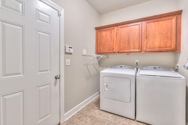 236 Danoher Walk, Murfreesboro, TN 37128 - laundry area with cabinet space, washing machine and clothes dryer, baseboards, and light tile patterned flooring