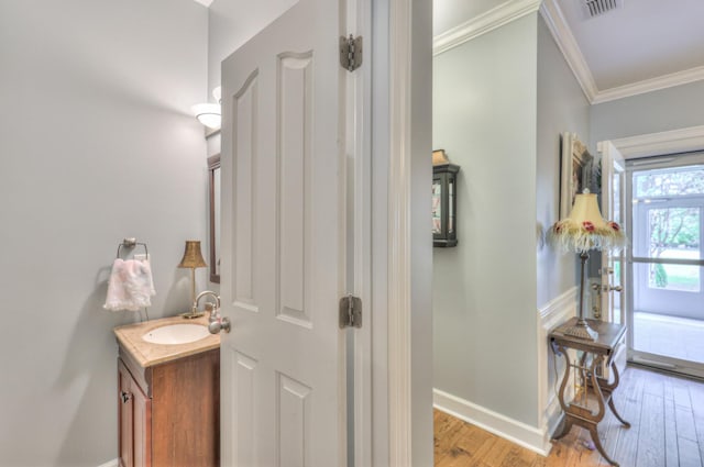 236 Danoher Walk, Murfreesboro, TN 37128 - bathroom featuring crown molding, baseboards, wood finished floors, and vanity