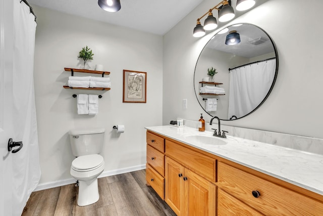 5440 Eugene Kennedy Ln, Cedar Hill, TN 37032 - full bath with wood finished floors, toilet, baseboards, and vanity
