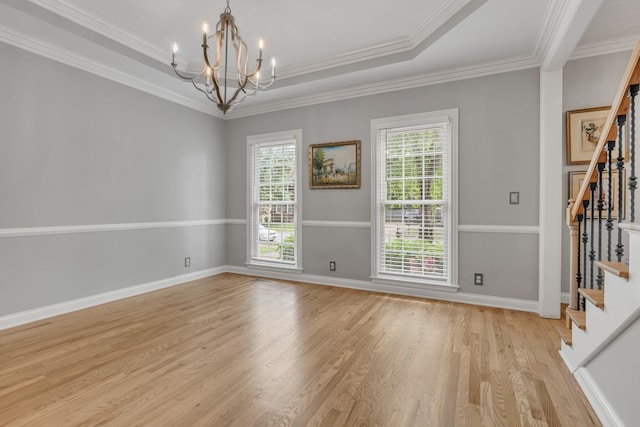 308 Stanley Park Ln, Franklin, TN 37069 - empty room with stairs, light wood-style flooring, a chandelier, baseboards, and crown molding