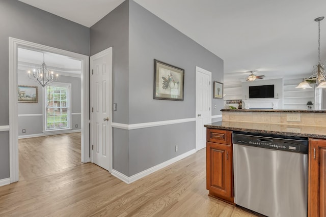 308 Stanley Park Ln, Franklin, TN 37069 - kitchen featuring stainless steel dishwasher, a chandelier, light wood-type flooring, and open floor plan