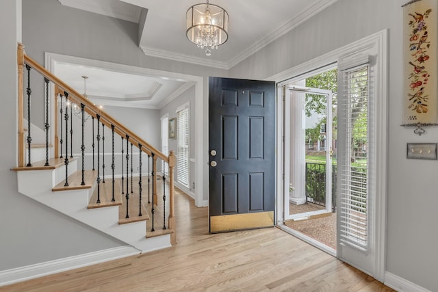 308 Stanley Park Ln, Franklin, TN 37069 - entrance foyer with a chandelier, crown molding, wood finished floors, baseboards, and stairway