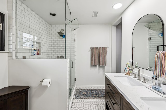 512 Westwood Dr, Tullahoma, TN 37388 - full bath with a shower stall, double vanity, baseboards, and tile patterned flooring