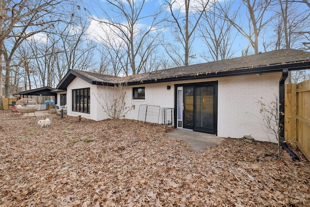 512 Westwood Dr, Tullahoma, TN 37388 - rear view of house featuring fence and brick siding