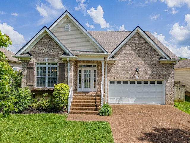 view of front of property featuring brick siding, driveway, a garage, and a front yard