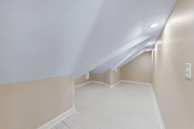 additional living space featuring lofted ceiling, recessed lighting, and baseboards