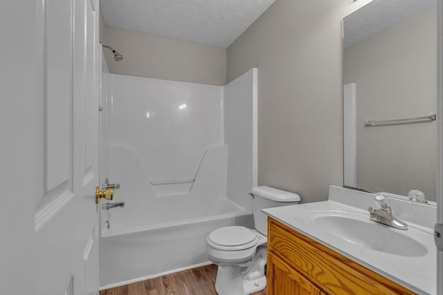 1514 Center Pointe Dr, Murfreesboro, TN 37130 - bathroom with wood finished floors, toilet, vanity, bathing tub / shower combination, and a textured ceiling