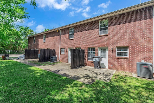 1514 Center Pointe Dr, Murfreesboro, TN 37130 - rear view of house with cooling unit, a patio area, and brick siding