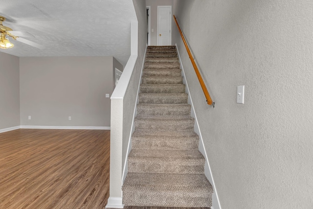 1514 Center Pointe Dr, Murfreesboro, TN 37130 - stairs with wood finished floors, ceiling fan, baseboards, a textured wall, and a textured ceiling