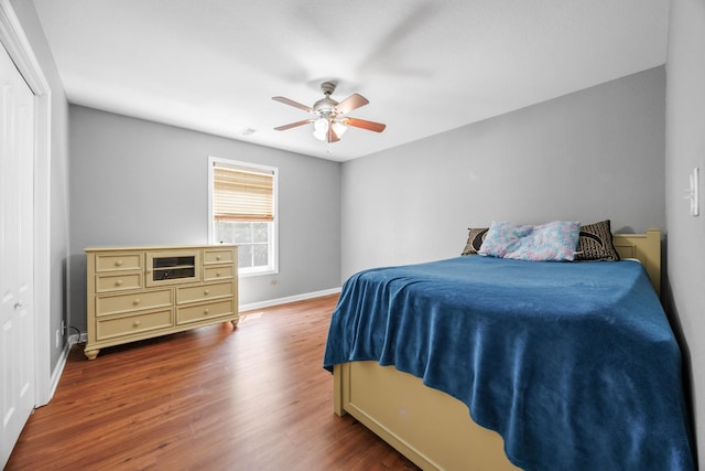 845 Nandina Ct, Clarksville, TN 37043 - bedroom featuring baseboards, wood finished floors, a ceiling fan, and a closet