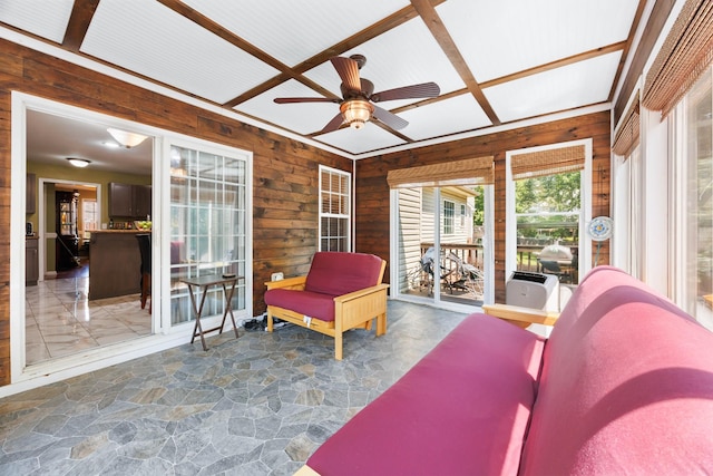 845 Nandina Ct, Clarksville, TN 37043 - sunroom with a ceiling fan, wooden walls, and stone floors