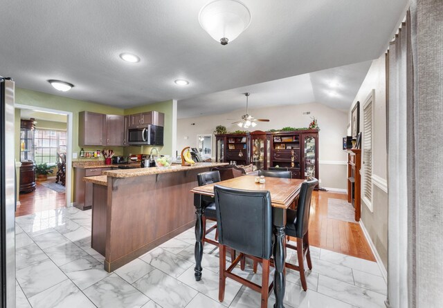 845 Nandina Ct, Clarksville, TN 37043 - dining room with light marble finish floors, ceiling fan, baseboards, recessed lighting, and vaulted ceiling