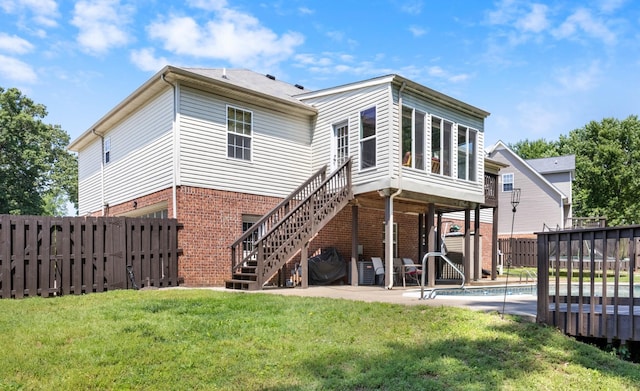 845 Nandina Ct, Clarksville, TN 37043 - back of property with brick siding, stairway, a deck, and a patio